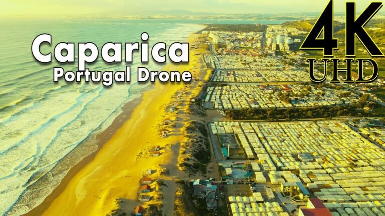 Caparica Portugal 4K drone | Aerial view of Caparica Beach in the Atlantic Ocean, Setubal, Portugal